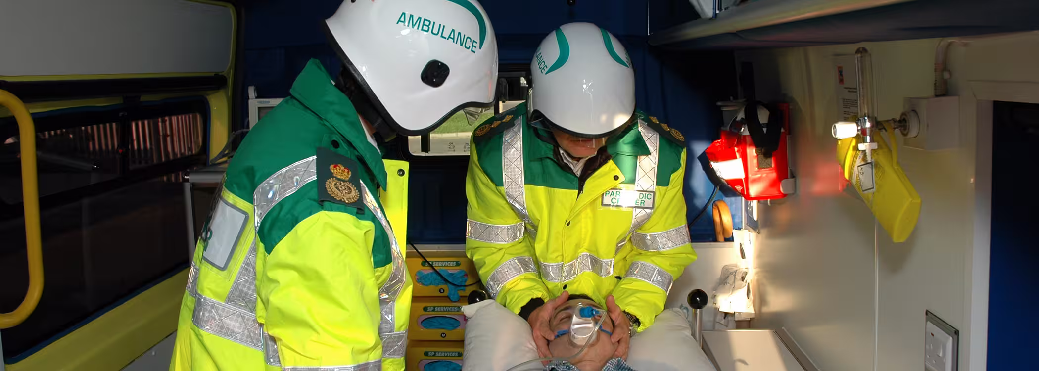 2 Ambulance workers wearing A7A Pacific Helmets, Helmets with custom text "Ambulance" on the side
