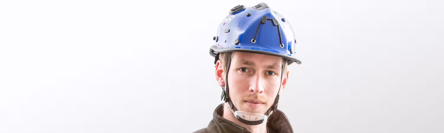 Person wearing a blue helmet, Model R5SLV from Pacific Helmets Lakeland