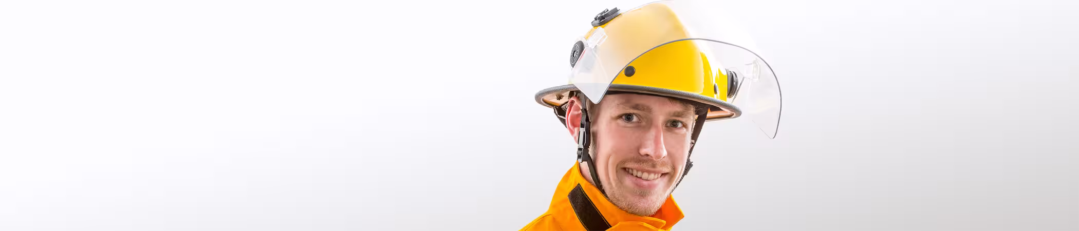 Firefighter wearing A yellow helmet from Pacific Helmets Lakeland